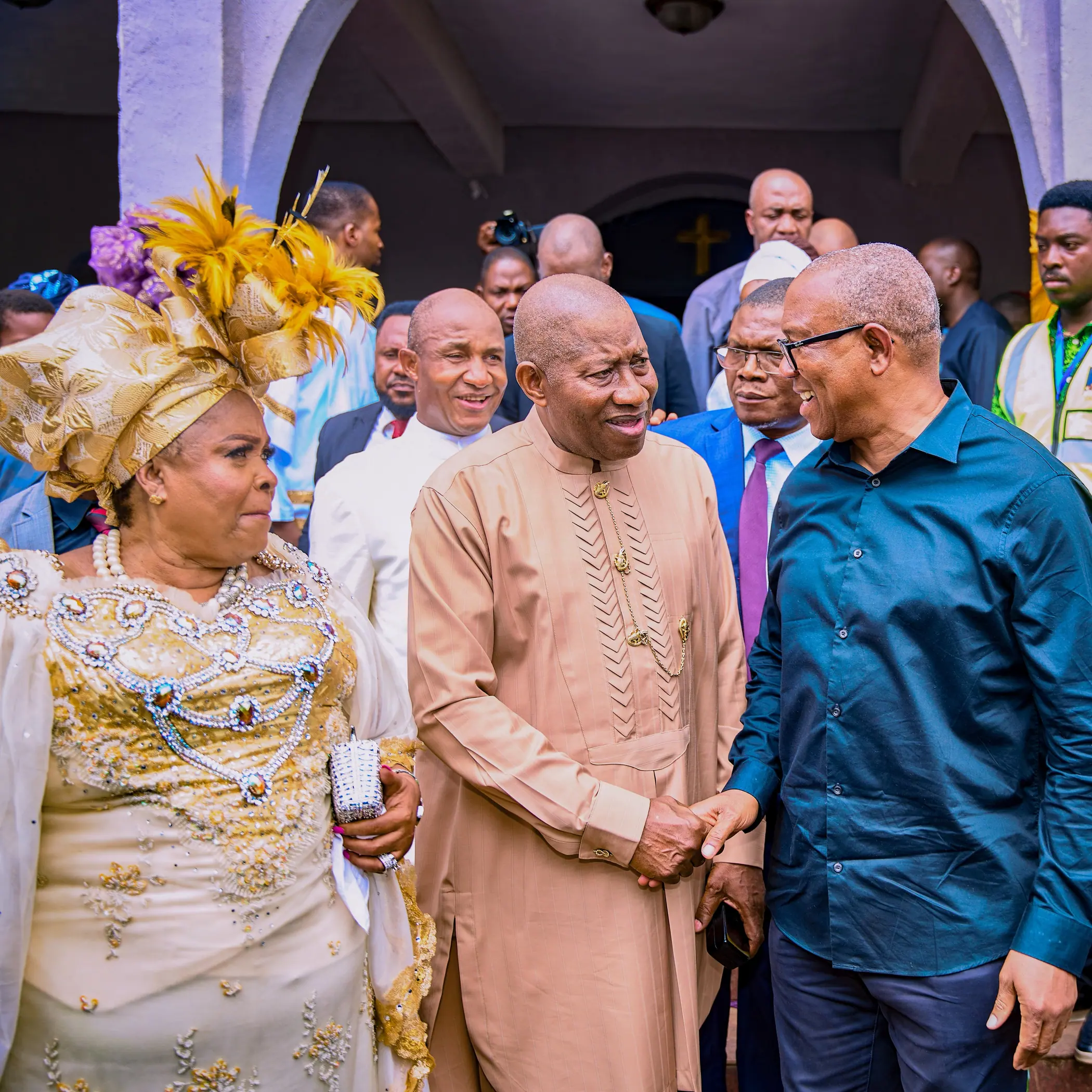 Patience Jonathan, former President Goodluck Jonathan and Peter Obi coming out of a church door together