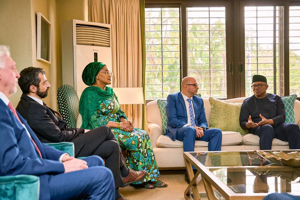 Peter Obi in conversation with a visiting delegation seated on sofas in a sitting room