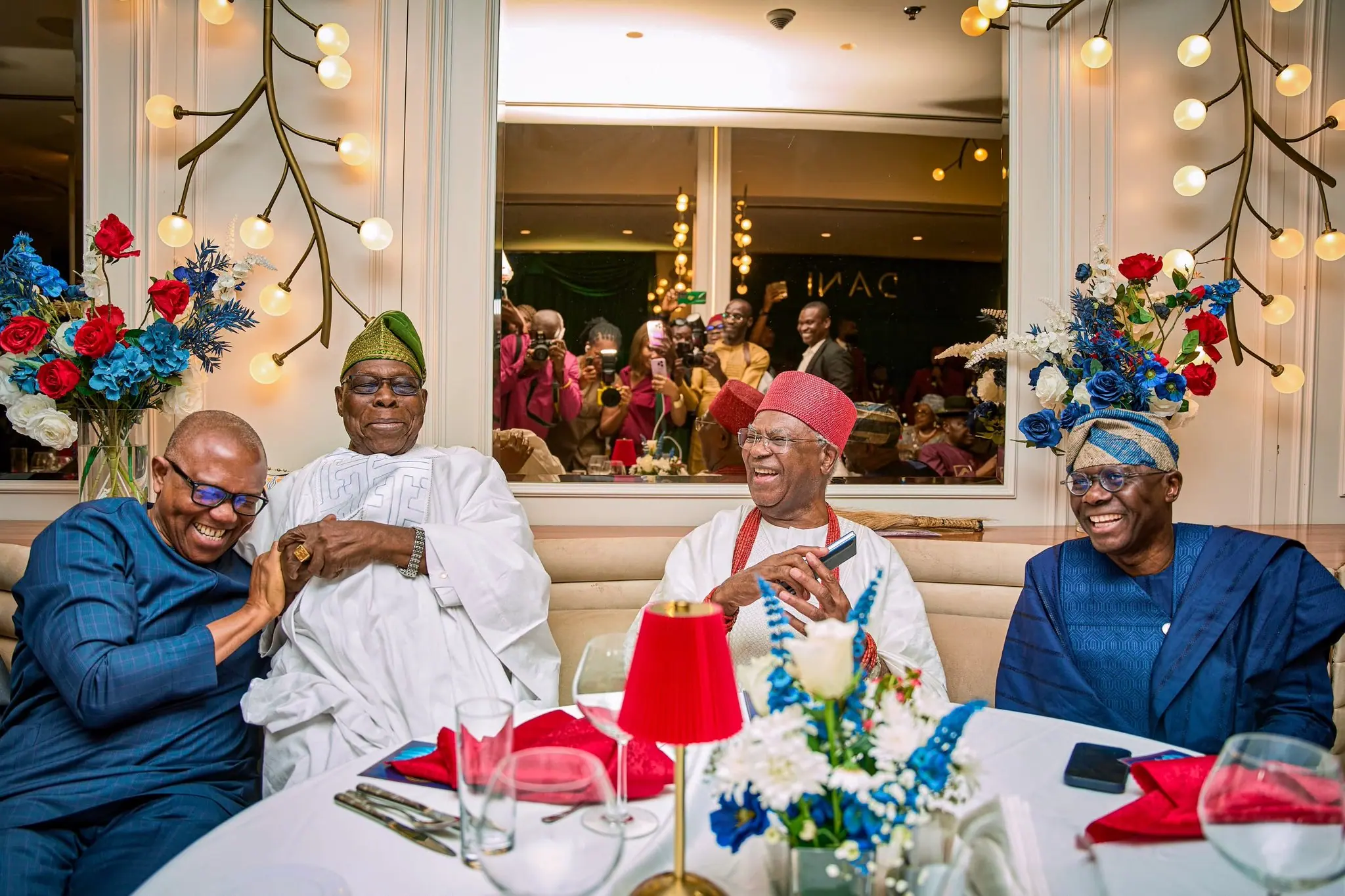 Peter Obi laughing at a dinner table with Olusegun Obasanjo, the Obi of Onitsha and Babajide Sanwo-Olu