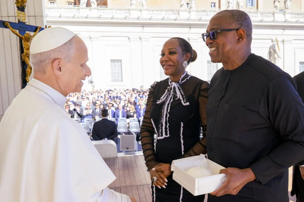 Peter Obi and his wife greeting Pope Leo XIV at St Peter's, a gift in a white box in his hands